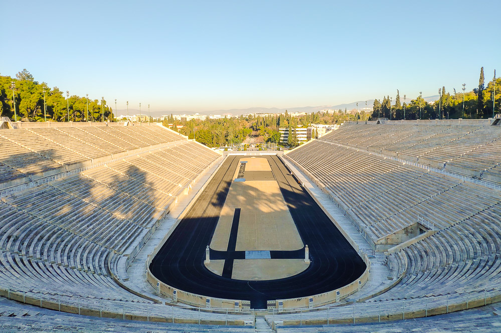 Image showing a view of the Panathenaic Stadium and it's running track taken from the bleachers/seating stands at the top.